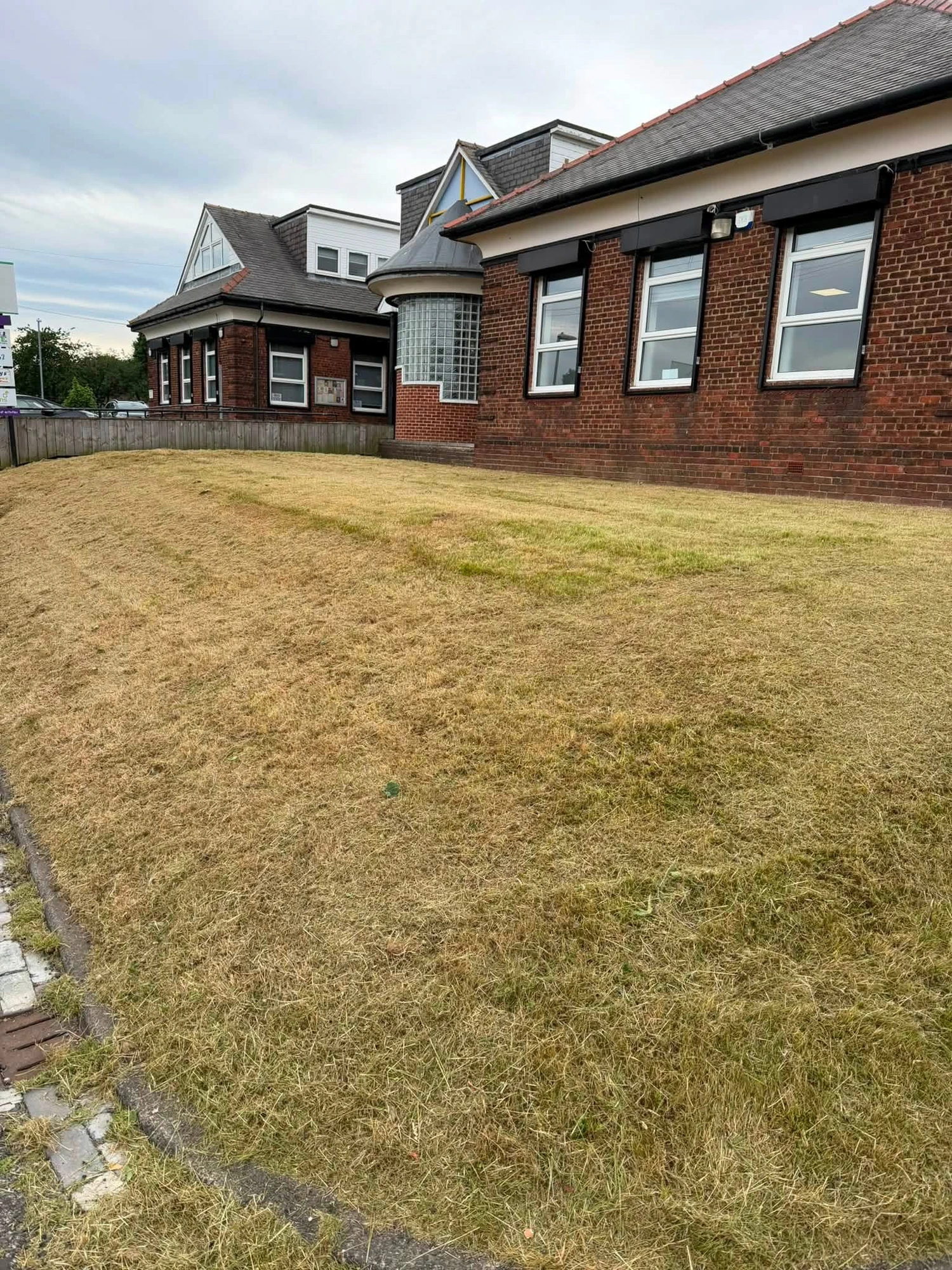 Overgrown frontage cut back — The Life House — after